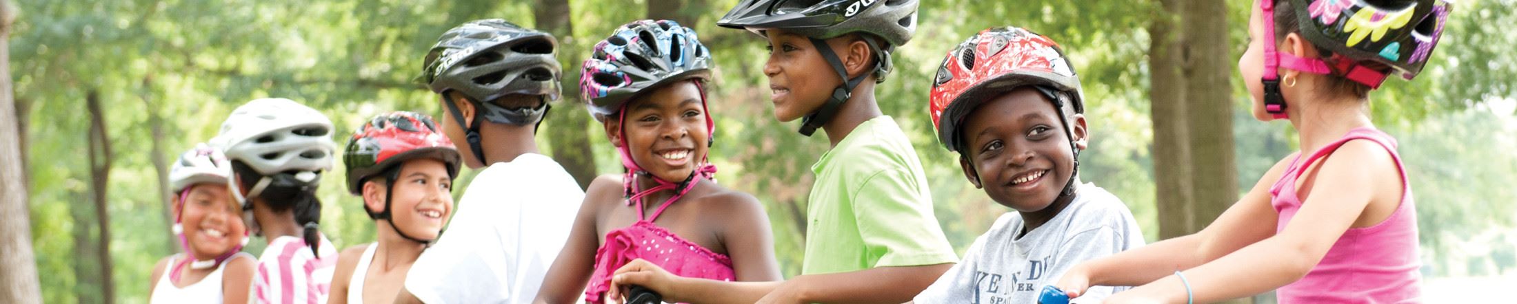 Kids chatting on bikes in a row